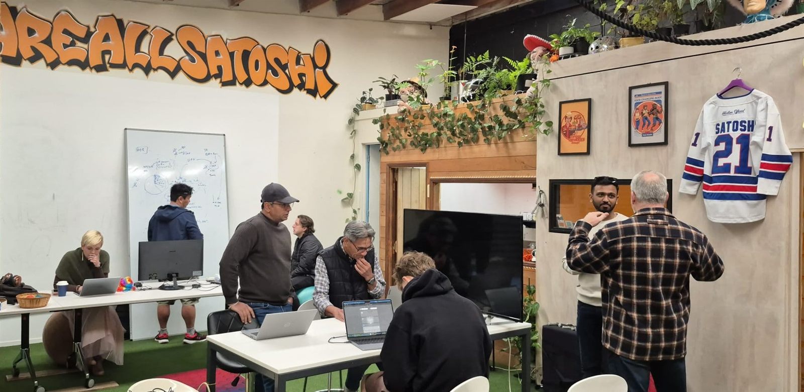 People gathered around screens during a workshop at Node Space Devonport