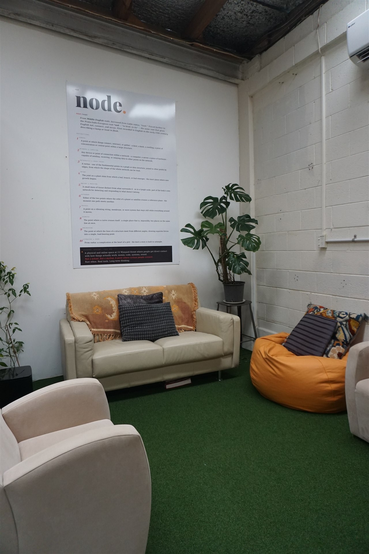 Lounge seating with node manifesto poster